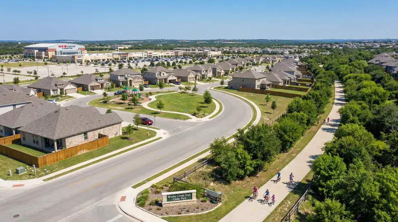 Cedar Park TX Brushy Creek trail with families biking, HEB Center arena, and new master-planned homes