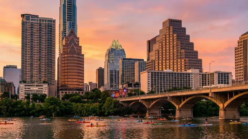 Downtown Austin Lady Bird Lake with kayakers, Congress Avenue Bridge, and skyline at golden hour