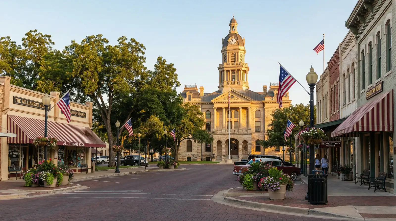Georgetown TX historic town square with Williamson County Courthouse, Victorian shops, and American flags