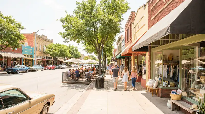 South Congress Avenue in Austin with boutique storefronts, pedestrians, and outdoor dining