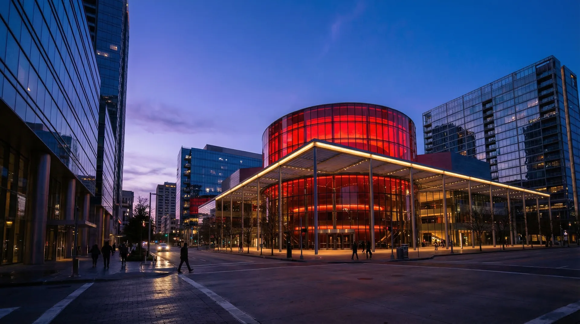 Dallas Arts District at twilight featuring the illuminated Winspear Opera House modern architecture