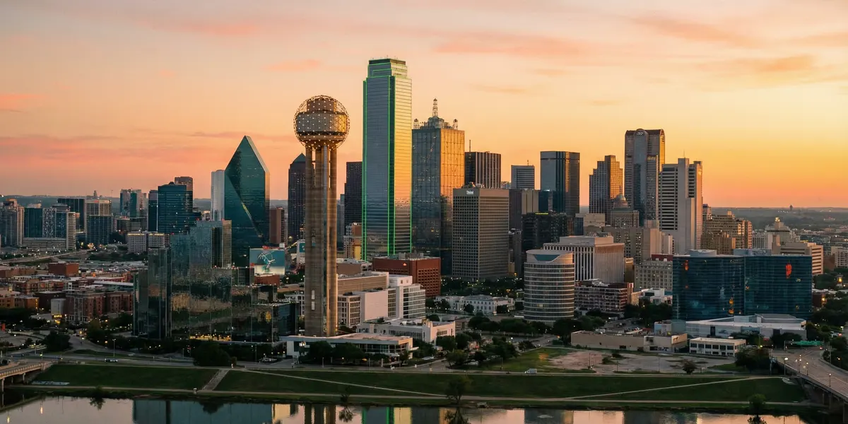 Moving to Dallas — downtown skyline at golden hour with Reunion Tower and skyscrapers on the Trinity River