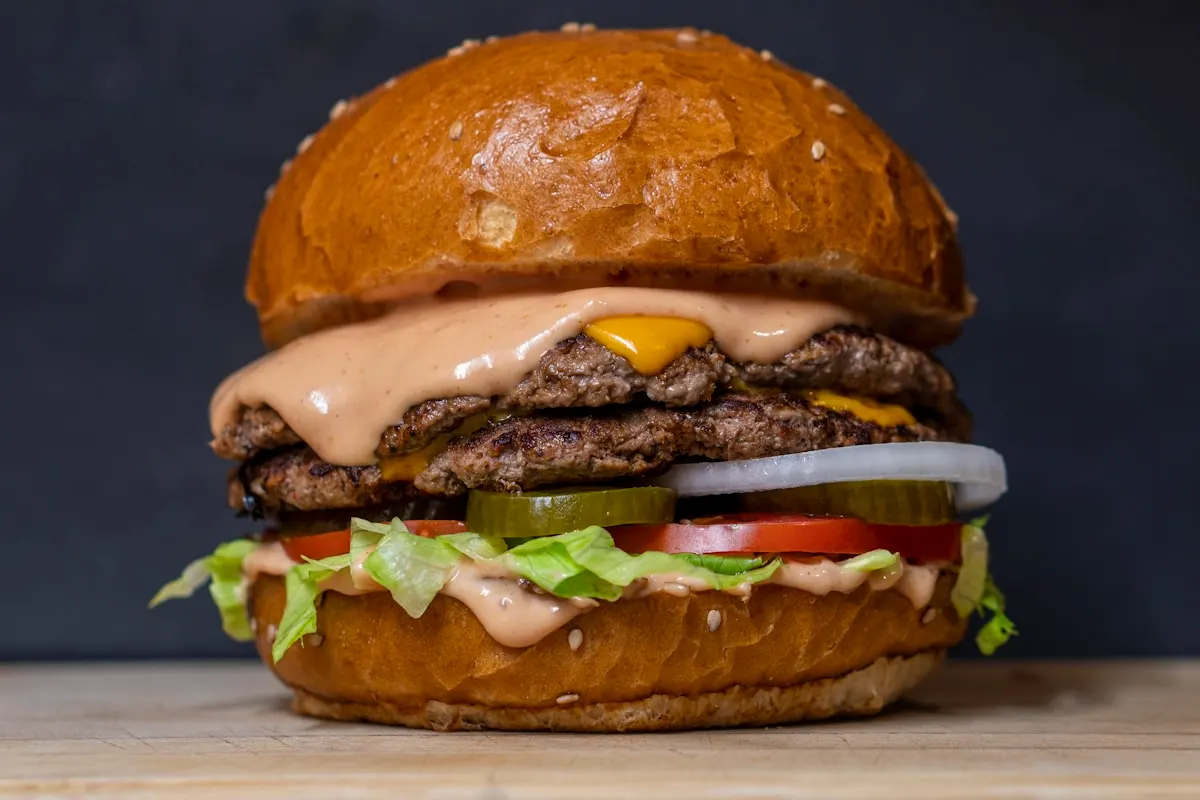 Gourmet smash burger with melted cheese on a soft bun