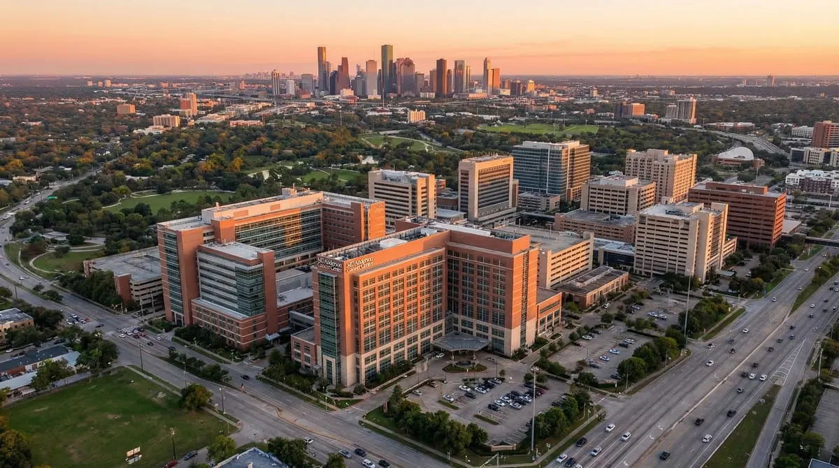 Aerial view of the Texas Medical Center campus in Houston at golden hour with MD Anderson Cancer Center buildings and the Houston skyline